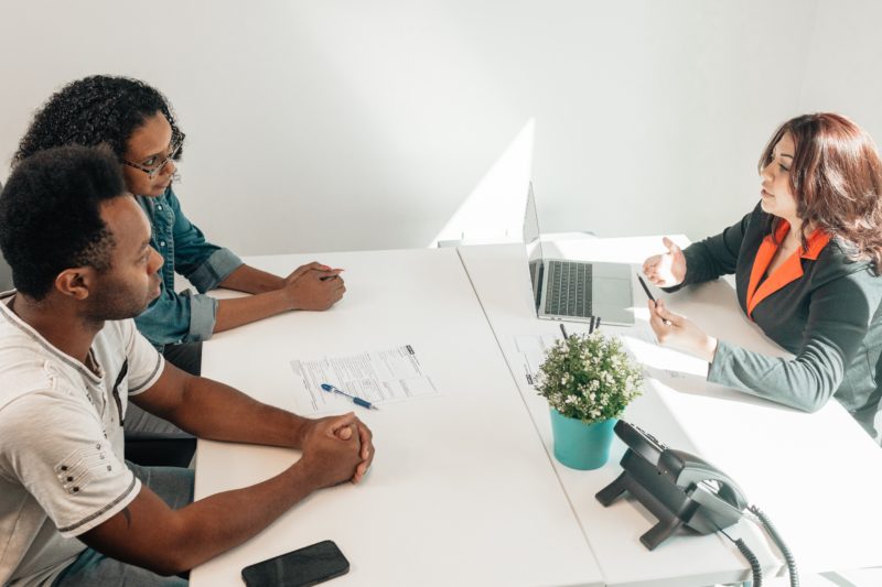 financial advisor working together with young couple