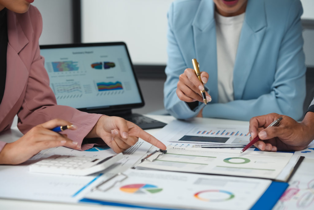 financial experts working on stock portfolio analysis