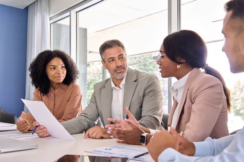 Busy international executive business team having discussion at office meeting